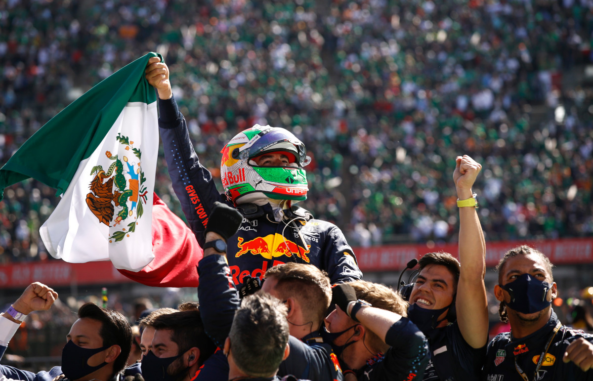 Sergio Perez celebrates, waves Mexican flag. Mexico November 2021