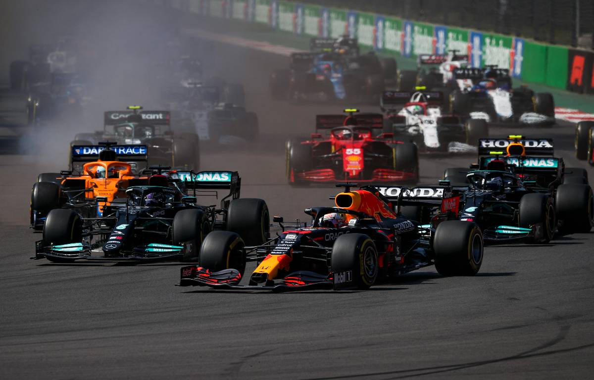 Max Verstappen outbrakes Mercedes at the Formula 1 Mexican GP start. November 2021.