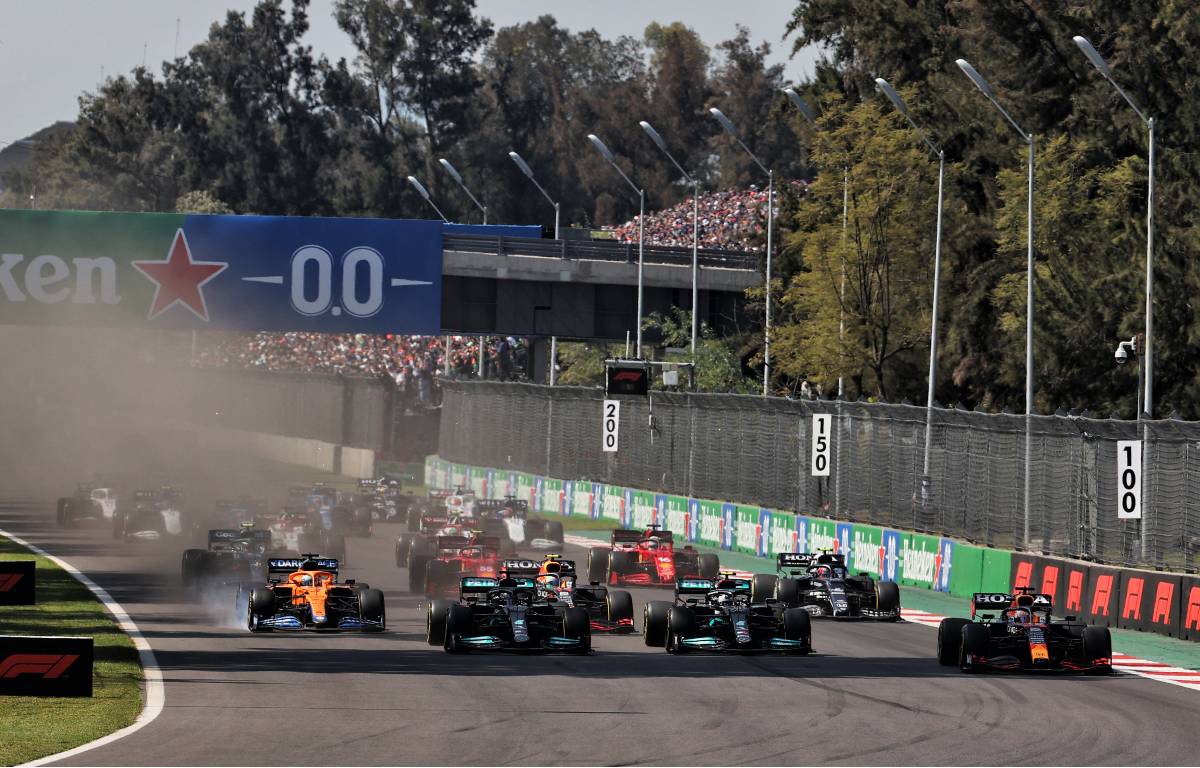 Max Verstappen (right) leads into the first corner of the Mexican GP. Mexico City November 2021.
