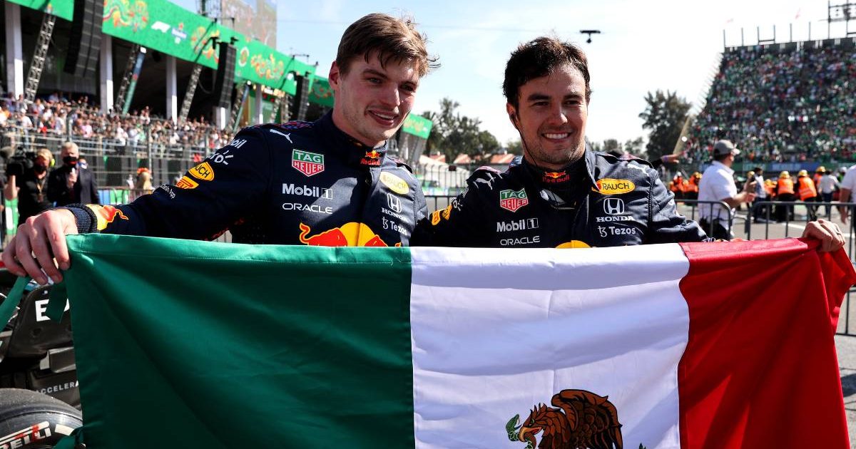 Max Verstappen and Sergio Perez holding a Mexican flag. Mexico City November 2021.