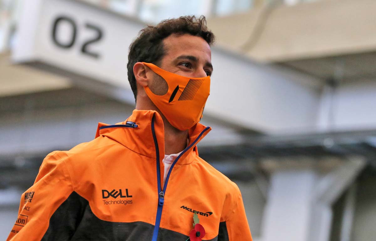 McLaren driver Daniel Ricciardo walks through the paddock. Brazil November 2021.