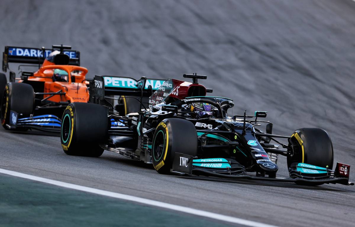 Lewis Hamilton's Mercedes ahead of a McLaren in Brazil. Interlagos November 2021.