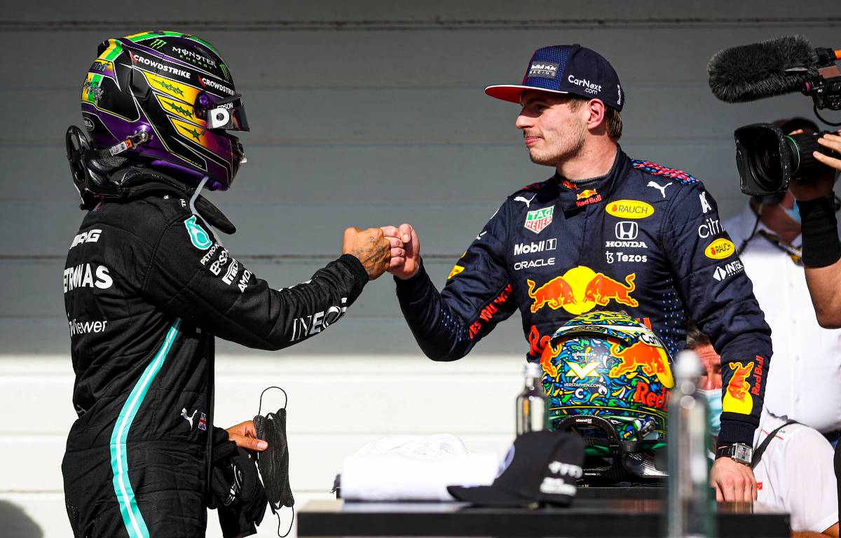 Lewis Hamilton and Max Verstappen fist bump in Brazil. November 2021.