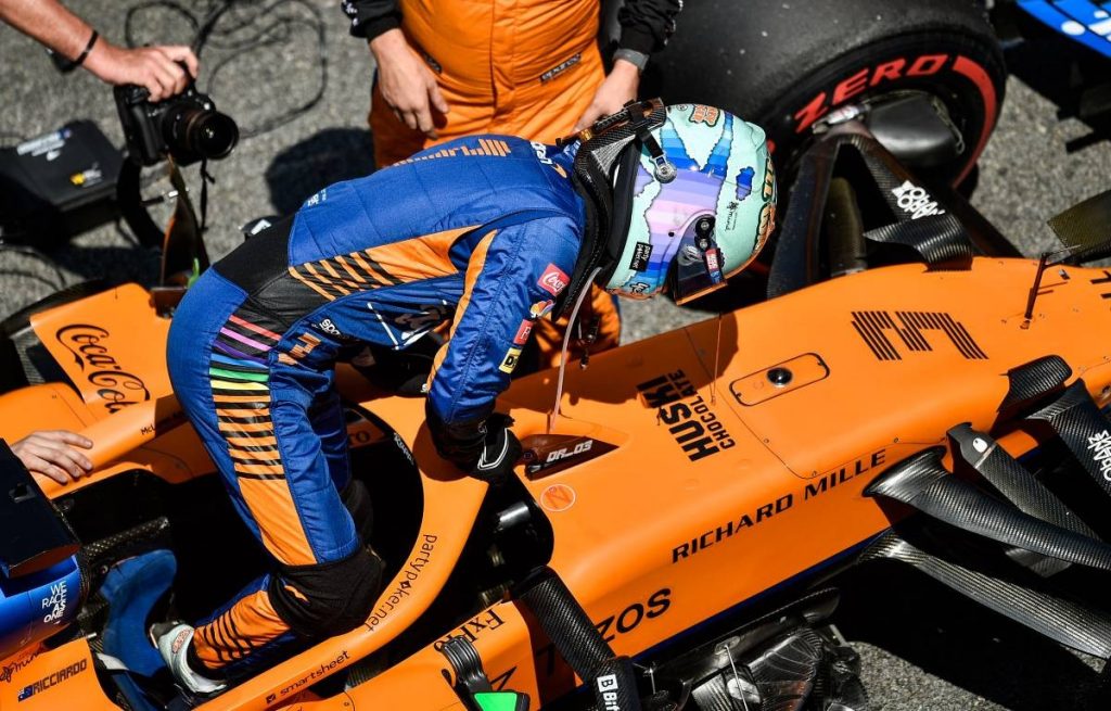 Daniel Ricciardo exits his McLaren cockpit. Brazil, November 2021.