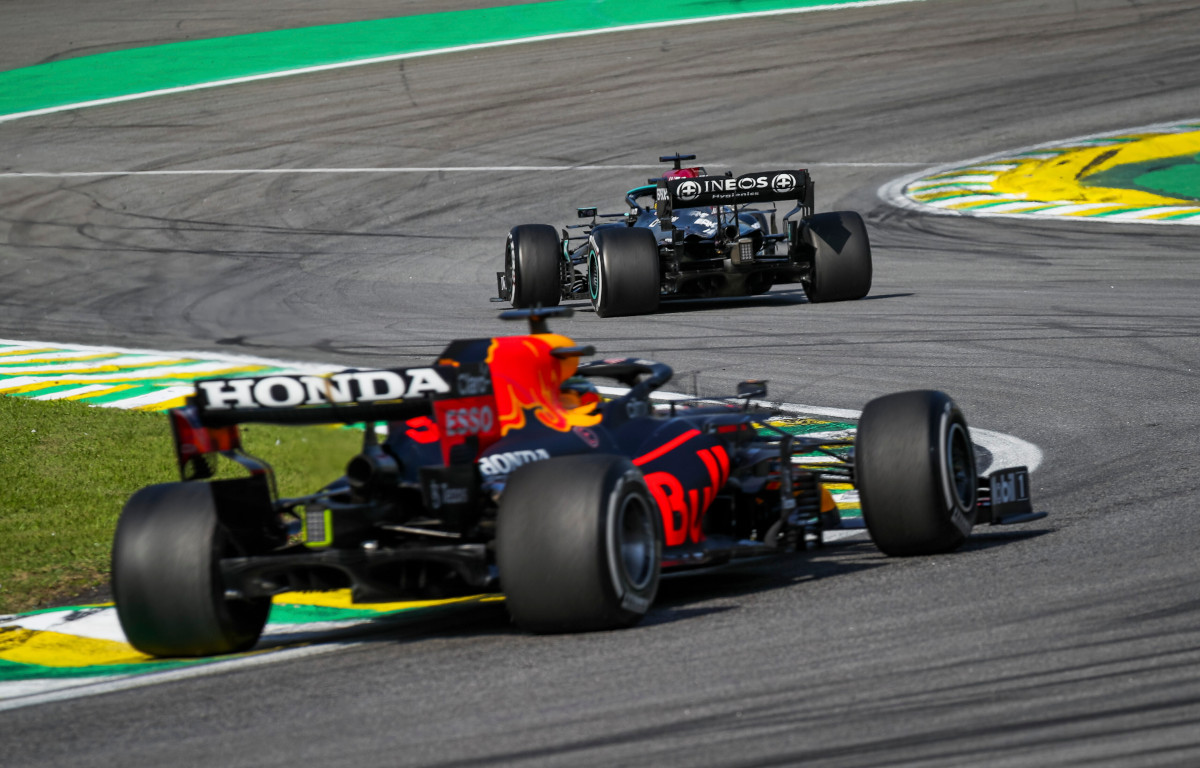 Mercedes driver Lewis Hamilton pulls in front of Max Verstappen. Brazil November 2021