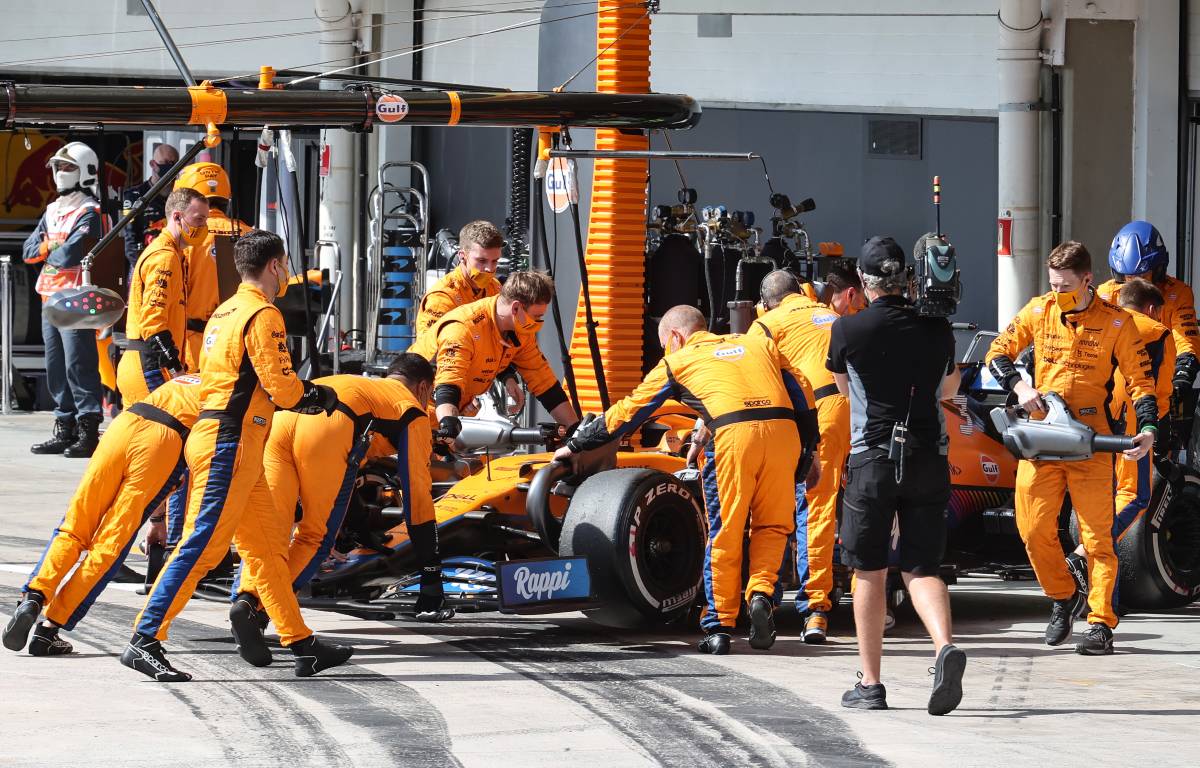 Daniel Ricciardo's McLaren is wheeled into the garage at the Sao Paulo GP. Interlagos November 2021.