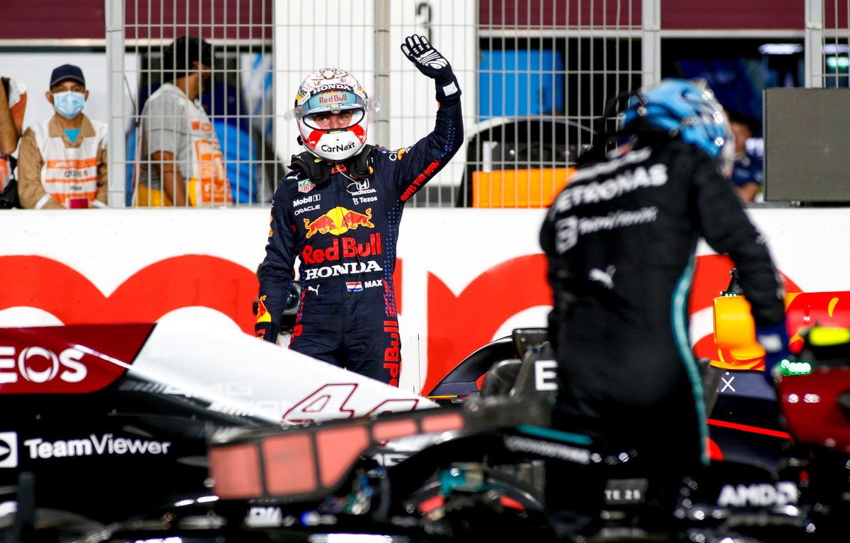 Max Verstappen waves, Valtteri Bottas in the foreground. Qatar November 2021