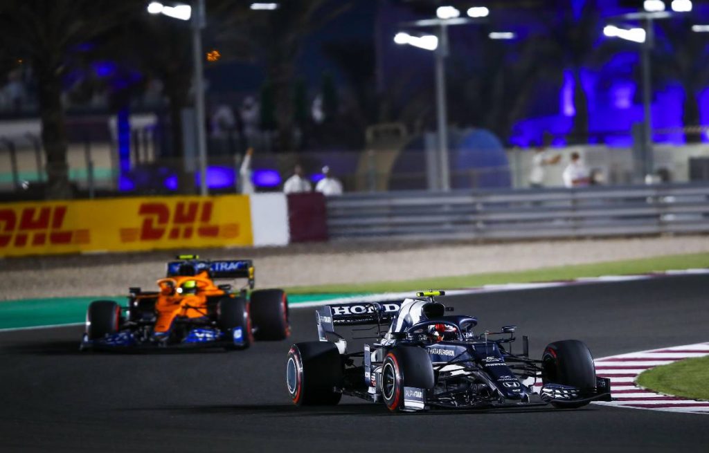 Pierre Gasly ahead of a McLaren during the Qatar GP. Lusail November 2021.