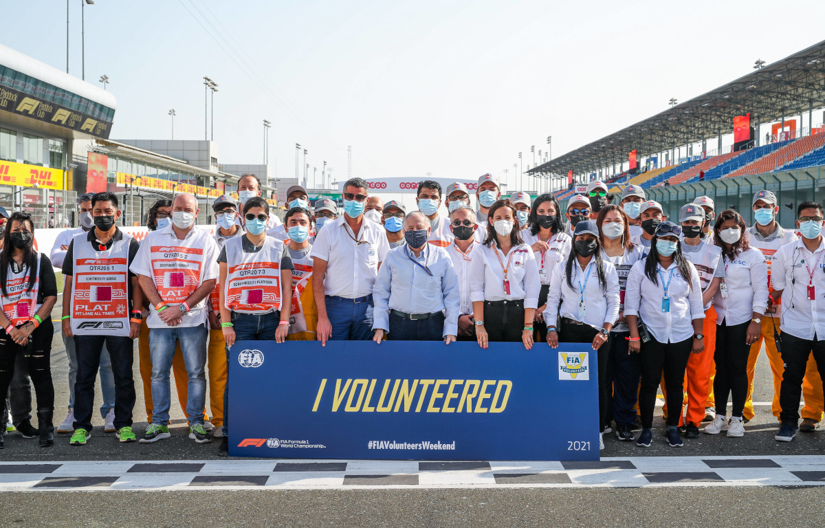 FIA race director Michael Masi and FIA president Jean Todt with Qatar marshal volunteers. Qatar November 2021