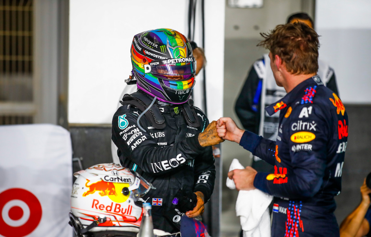 Lewis Hamilton and Max Verstappen bump fists. Qatar November 2021