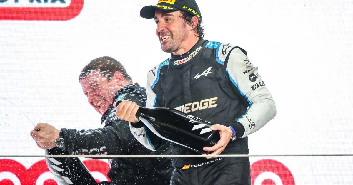 Fernando Alonso celebrates on the podium. Qatar November 2021.