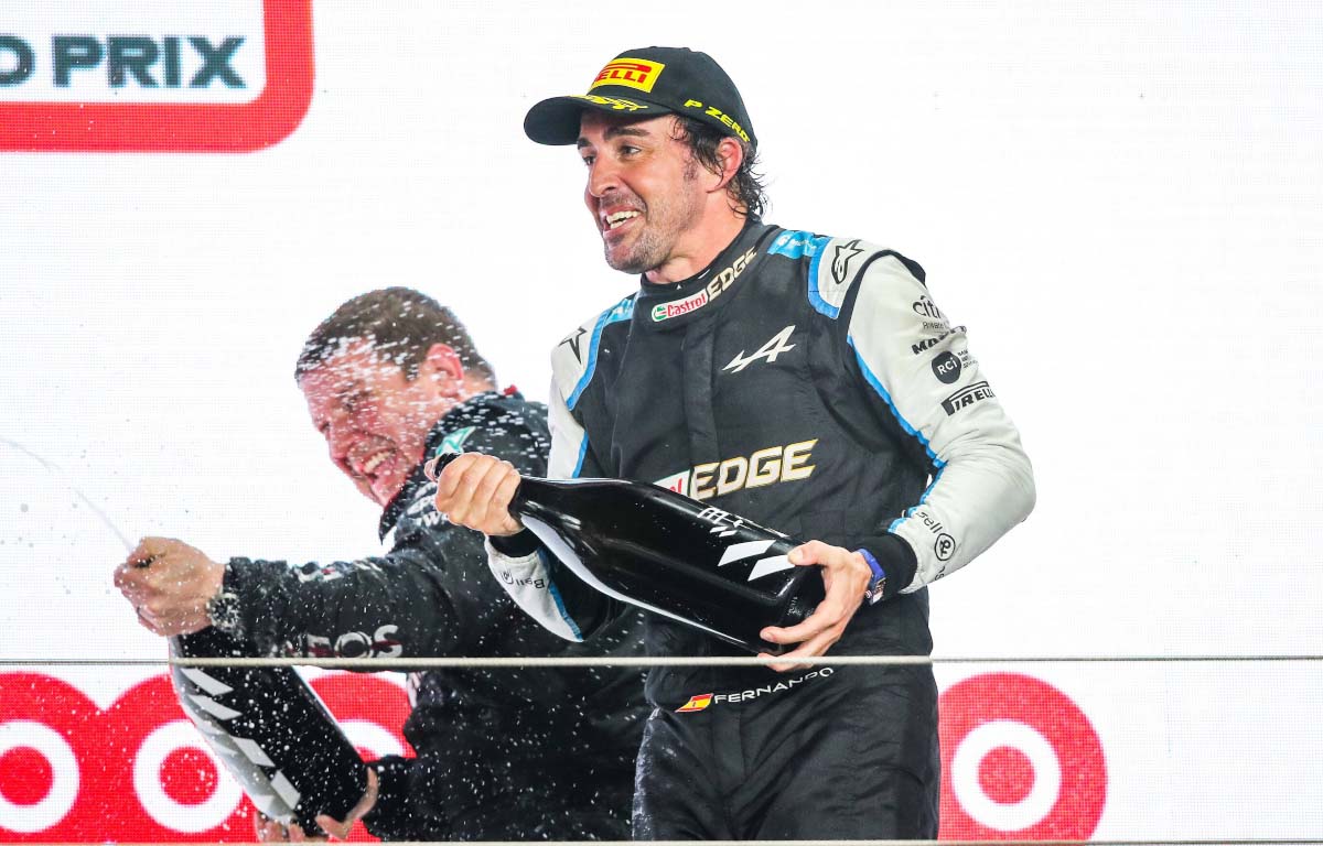Fernando Alonso celebrates on the podium. Qatar November 2021.