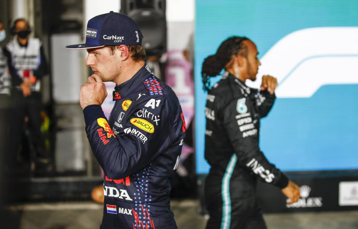 Max Verstappen and Lewis Hamilton cross paths. Qatar, November 2021.