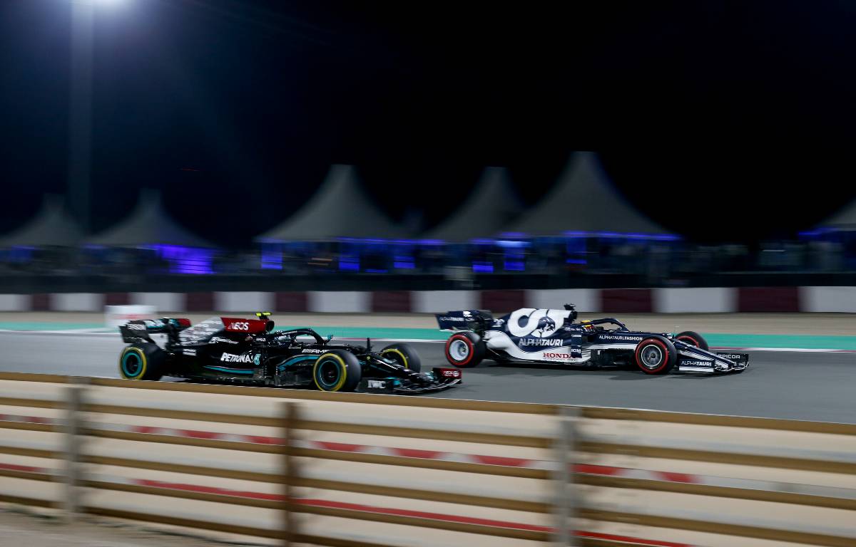 Valtteri Bottas alongside Yuki Tsunoda during the Qatar GP. Lusail November 2021.