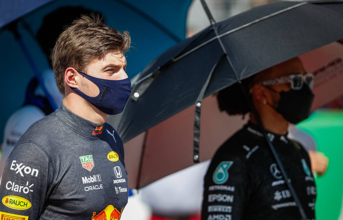 Max Verstappen and Lewis Hamilton with umbrellas. United States, October 2021.