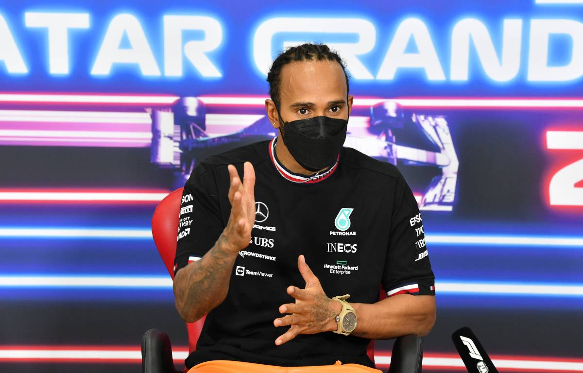 Lewis Hamilton wearing a mask at a press conference. Lusail November 2021.