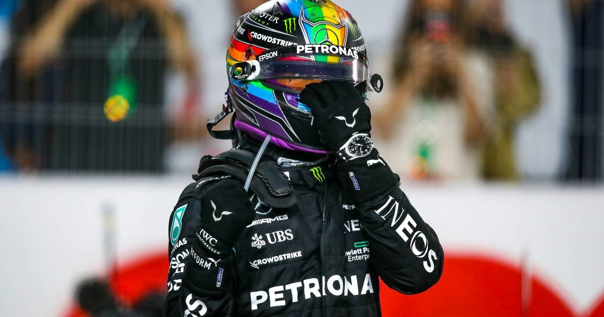 Lewis Hamilton, Mercedes, moves his helmet visor. Qatar, November 2021.