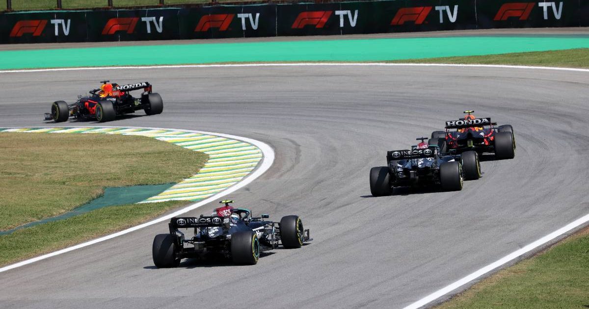 Max Verstappen and Sergio Perez, Red Bull, lead Lewis Hamilton and Valtteri Bottas, Mercedes. Brazil, November 2021.
