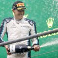 George Russell spraying the fizz after finishing second in the Belgian GP. Spa-Francorchamps August 2021.