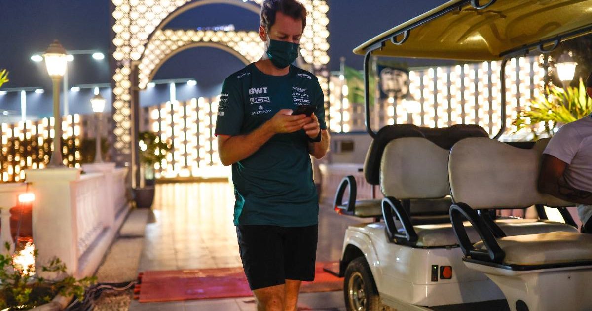 Sebastian Vettel on his phone. Saudi Arabia, December 2021.