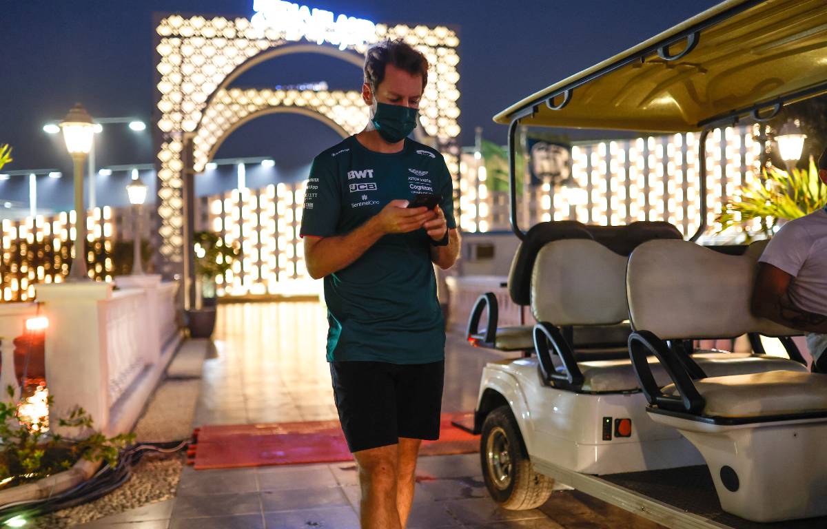 Sebastian Vettel on his phone. Saudi Arabia, December 2021.