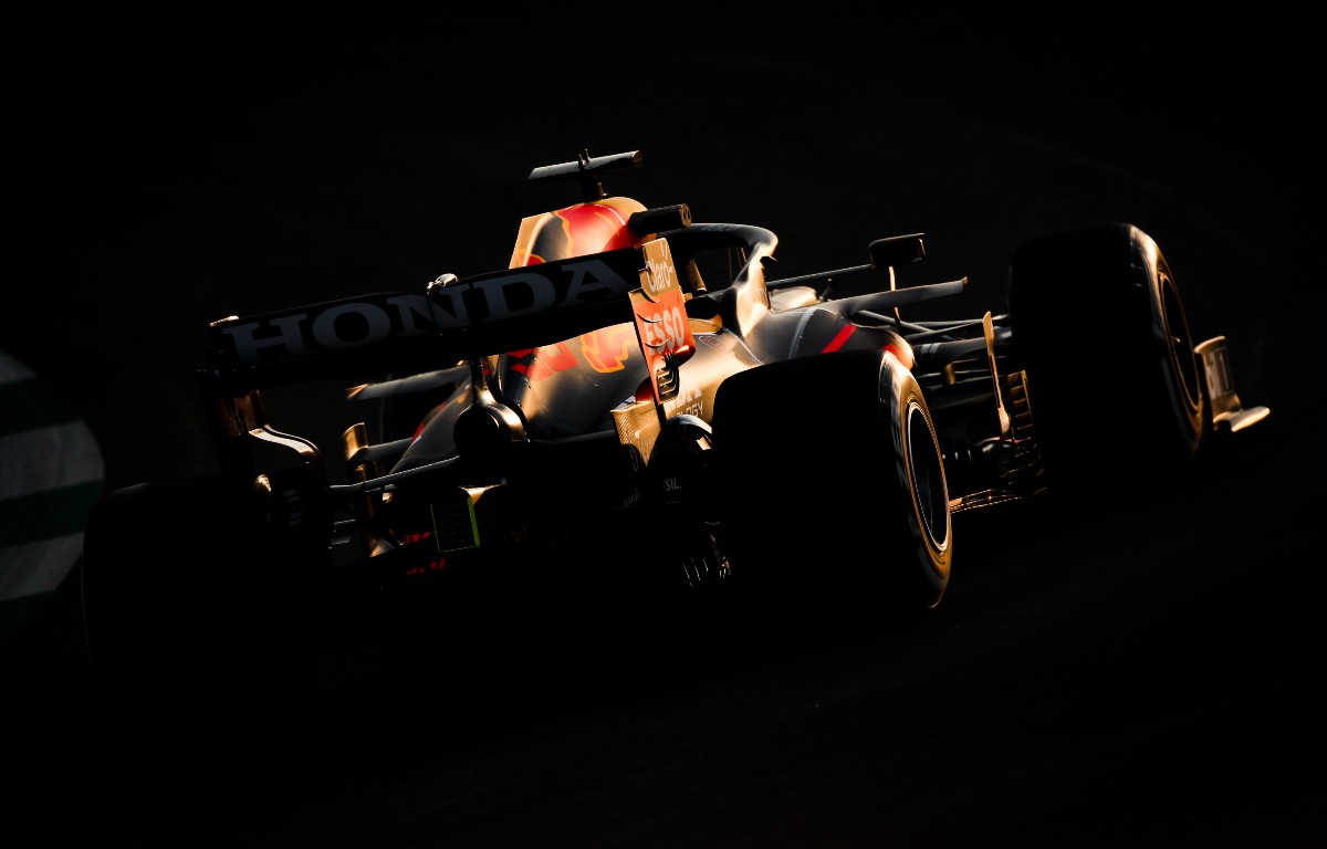 The sun sets on Max Verstappen, Red Bull, in Saudi Arabia. December 2021.