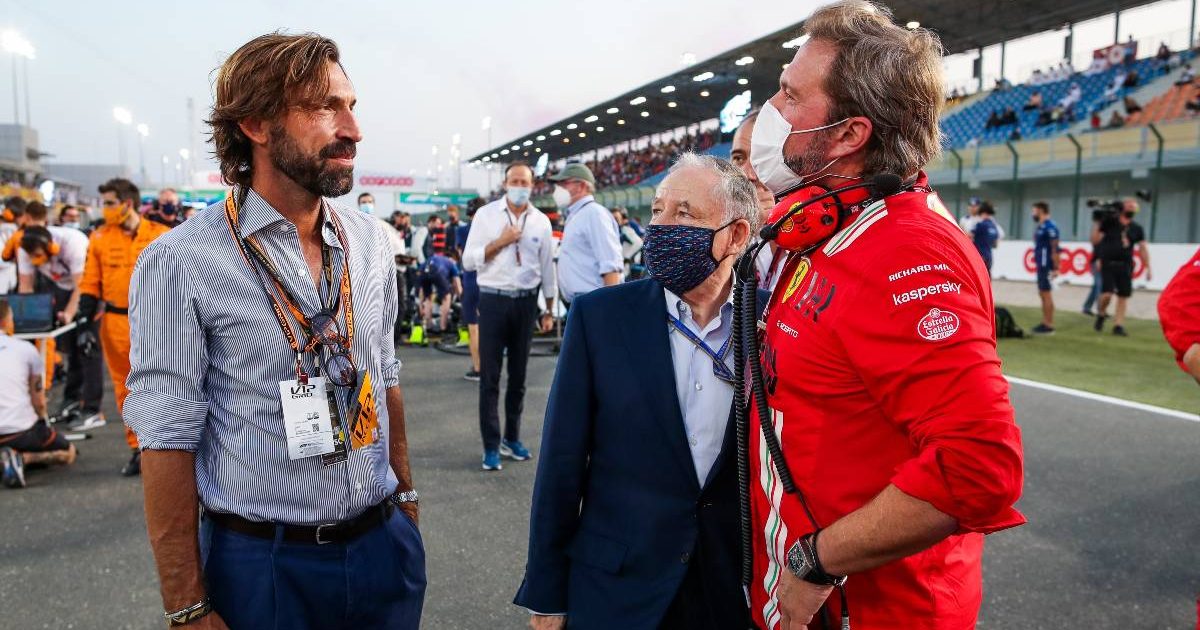 Jean Todt stands with a Ferrari staff member and Andrea Pirlo. Qatar, November 2021.