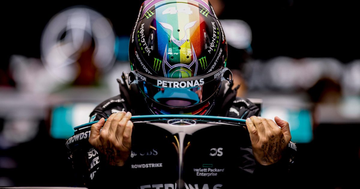 Lewis Hamilton climbing into his car. Abu Dhabi December 2021