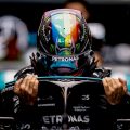 Lewis Hamilton climbing into his car. Abu Dhabi December 2021