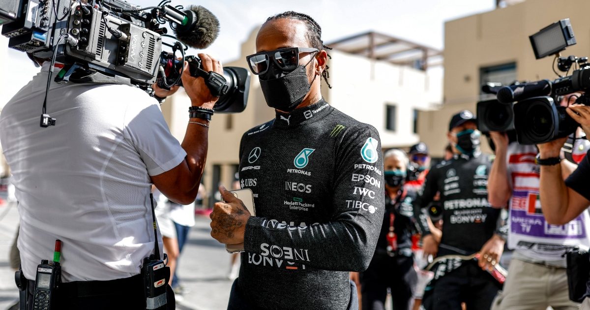 Lewis Hamilton walking past cameras. Abu Dhabi December 2021