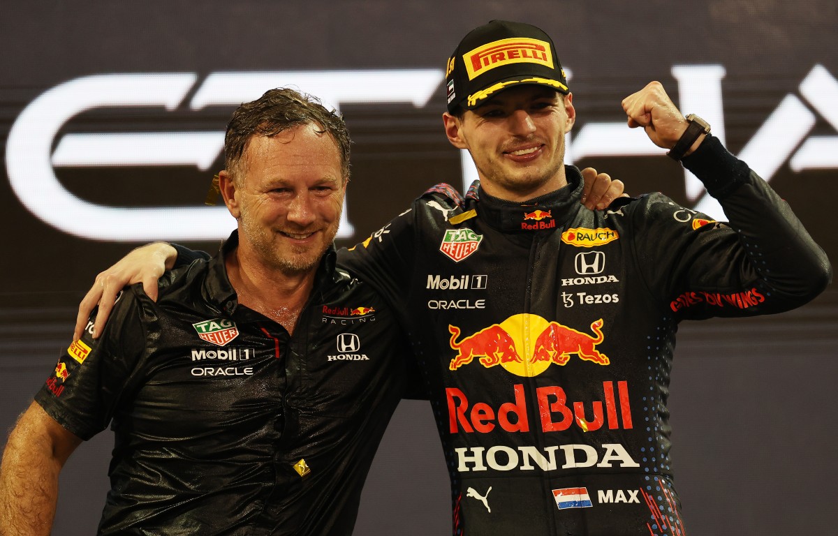 Christian Horner and Max Verstappen celebrate. Yas Marina December 2021.
