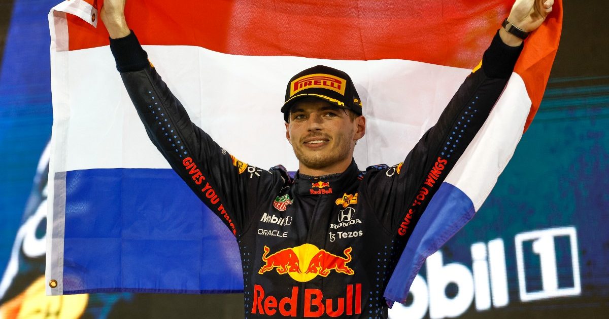 Max Verstappen holds the Dutch flag aloft. December 2021.