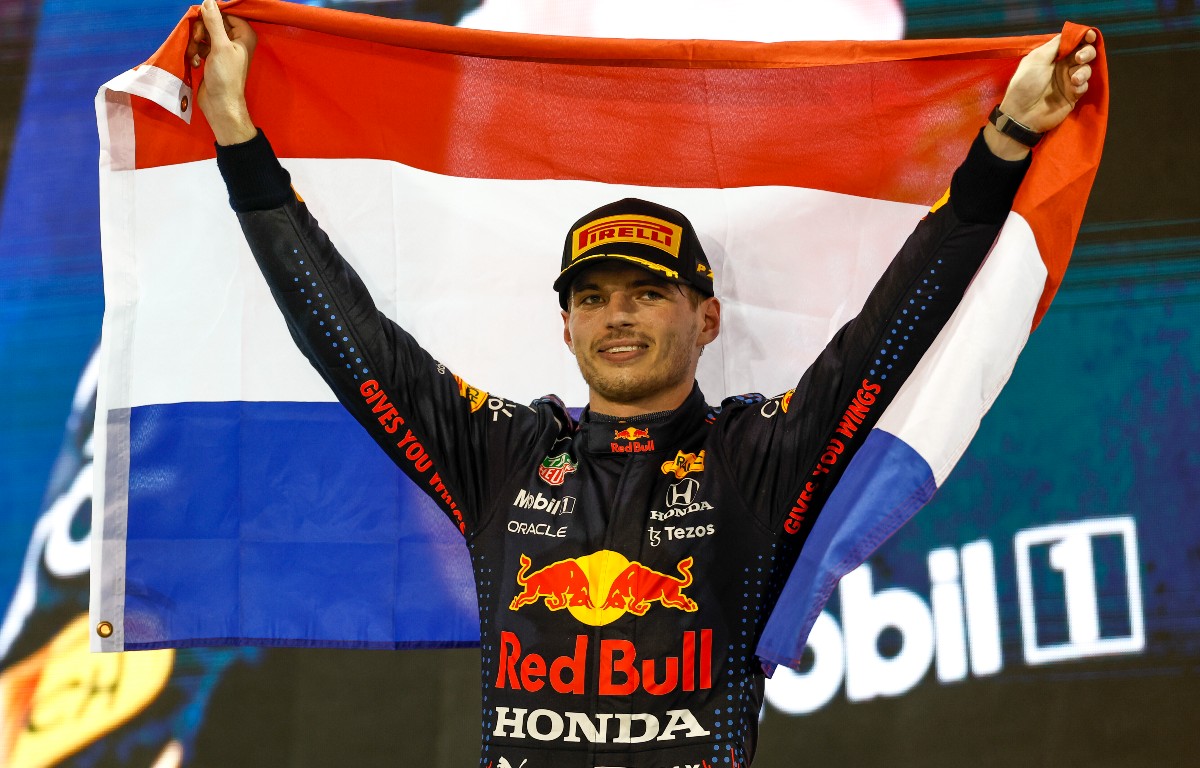 Max Verstappen holds the Dutch flag aloft. December 2021.