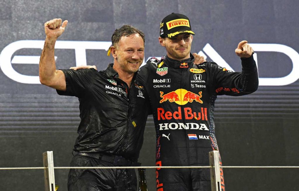 Christian Horner and Max Verstappen celebrate. Abu Dhabi December 2021.