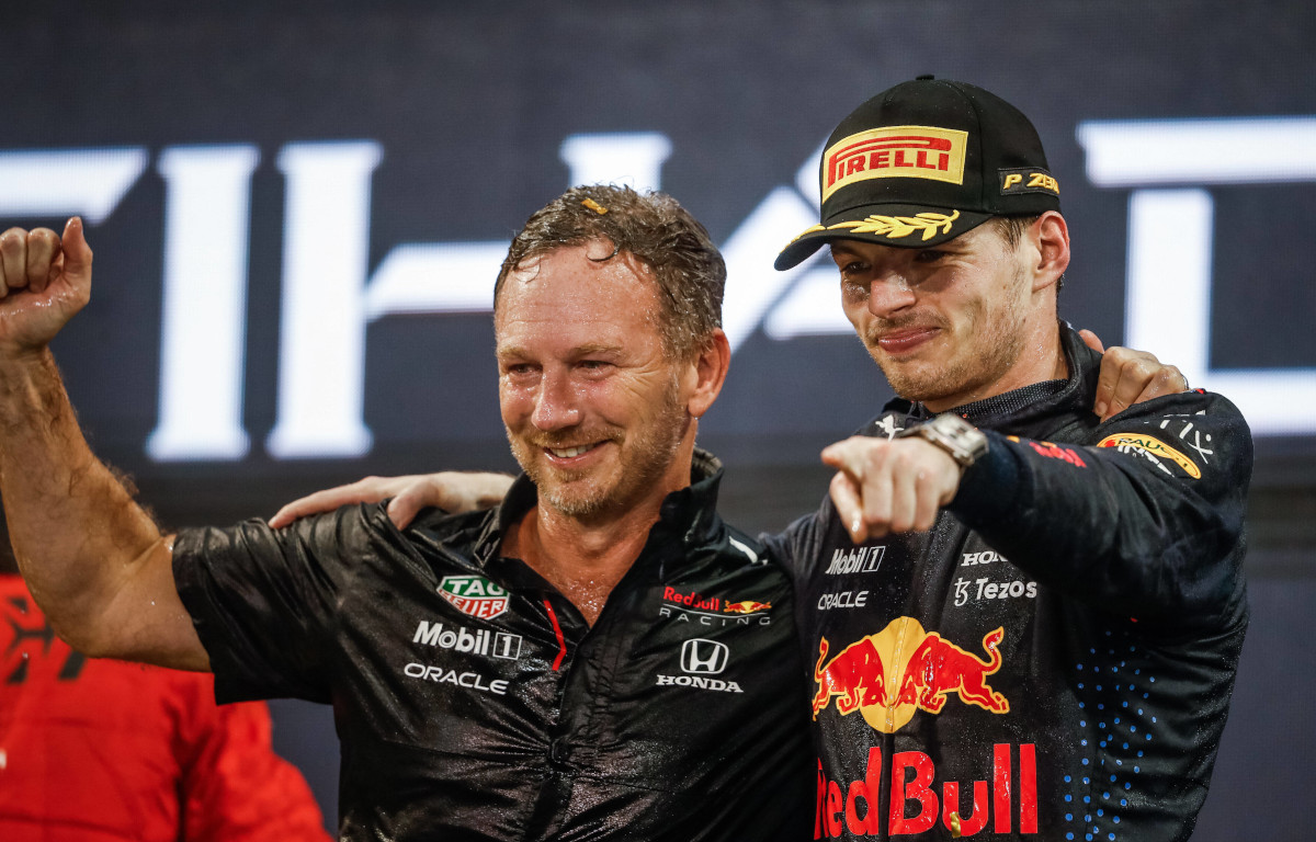 Max Verstappen and Christian Horner celebrate the win. Abu Dhabi December 2021