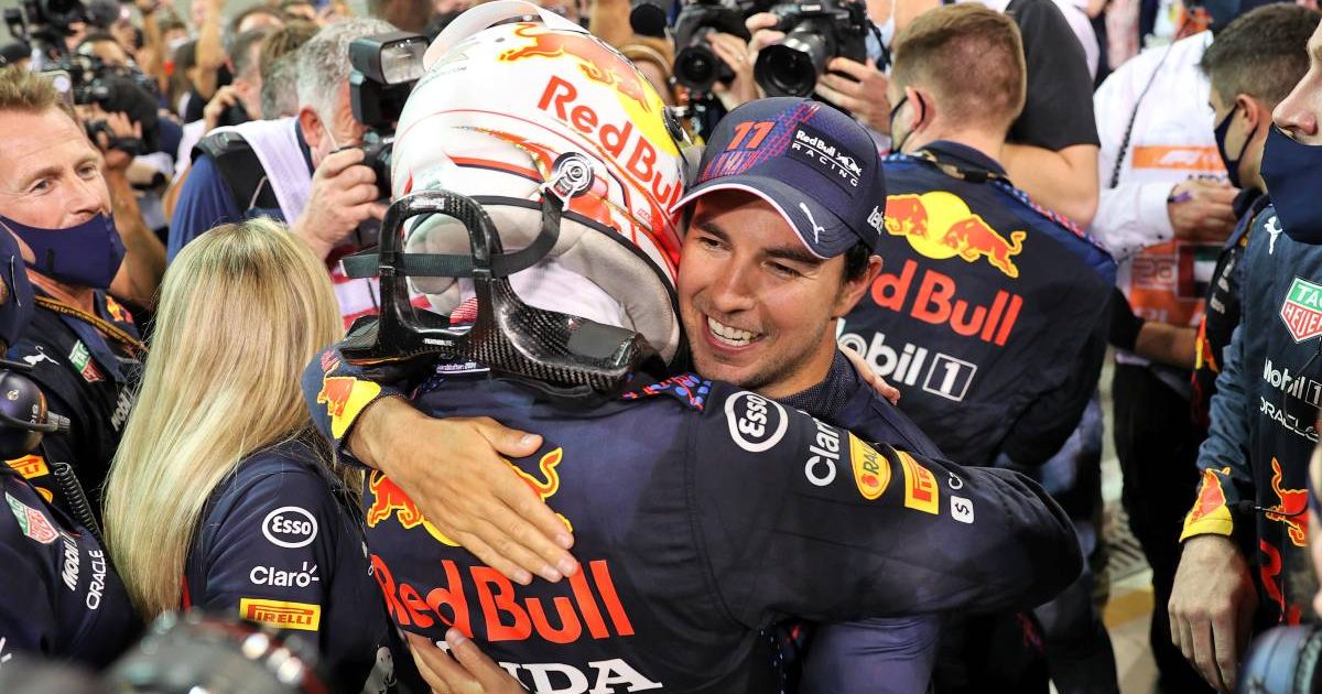 Max Verstappen hugs Sergio Perez after winning the Abu Dhabi GP.
