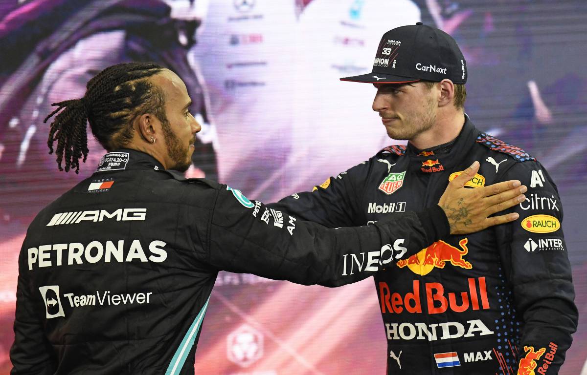 Lewis Hamilton and Max Verstappen embrace. Yas Marina December 2021.