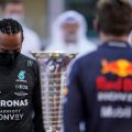 Lewis Hamilton looking down Drivers Championship trophy and Max Verstappen. Abu Dhabi December 2021