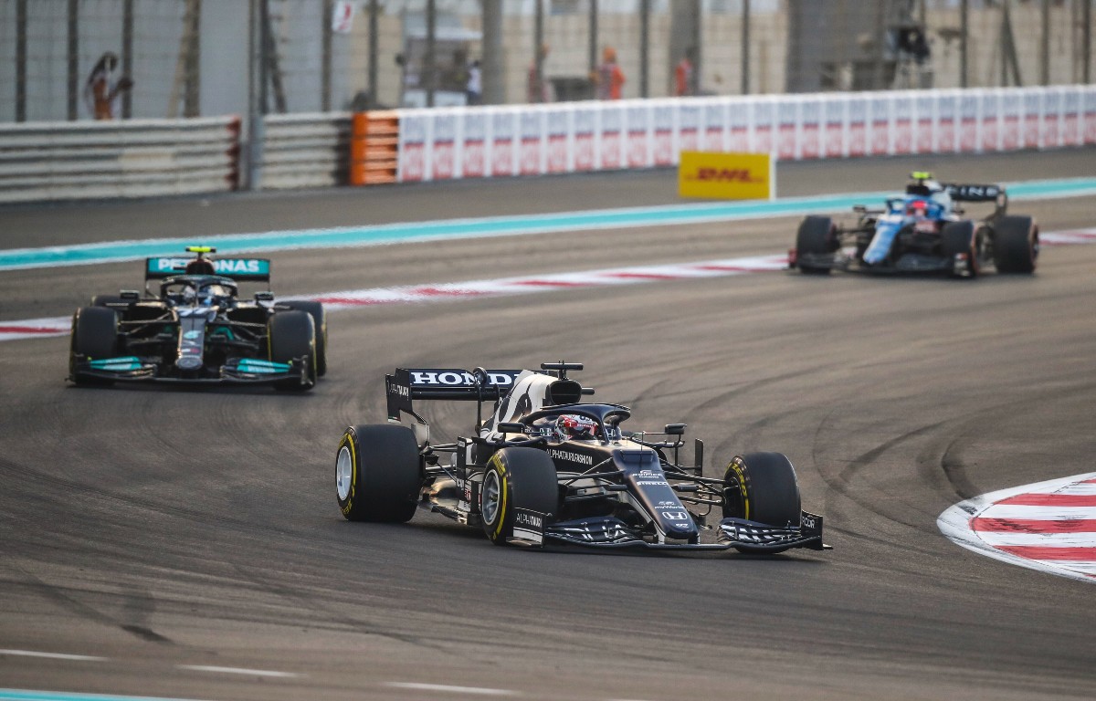 Yuki Tsunoda ahead of Valtteri Bottas during the Abu Dhabi GP. Yas Marina December 2021.