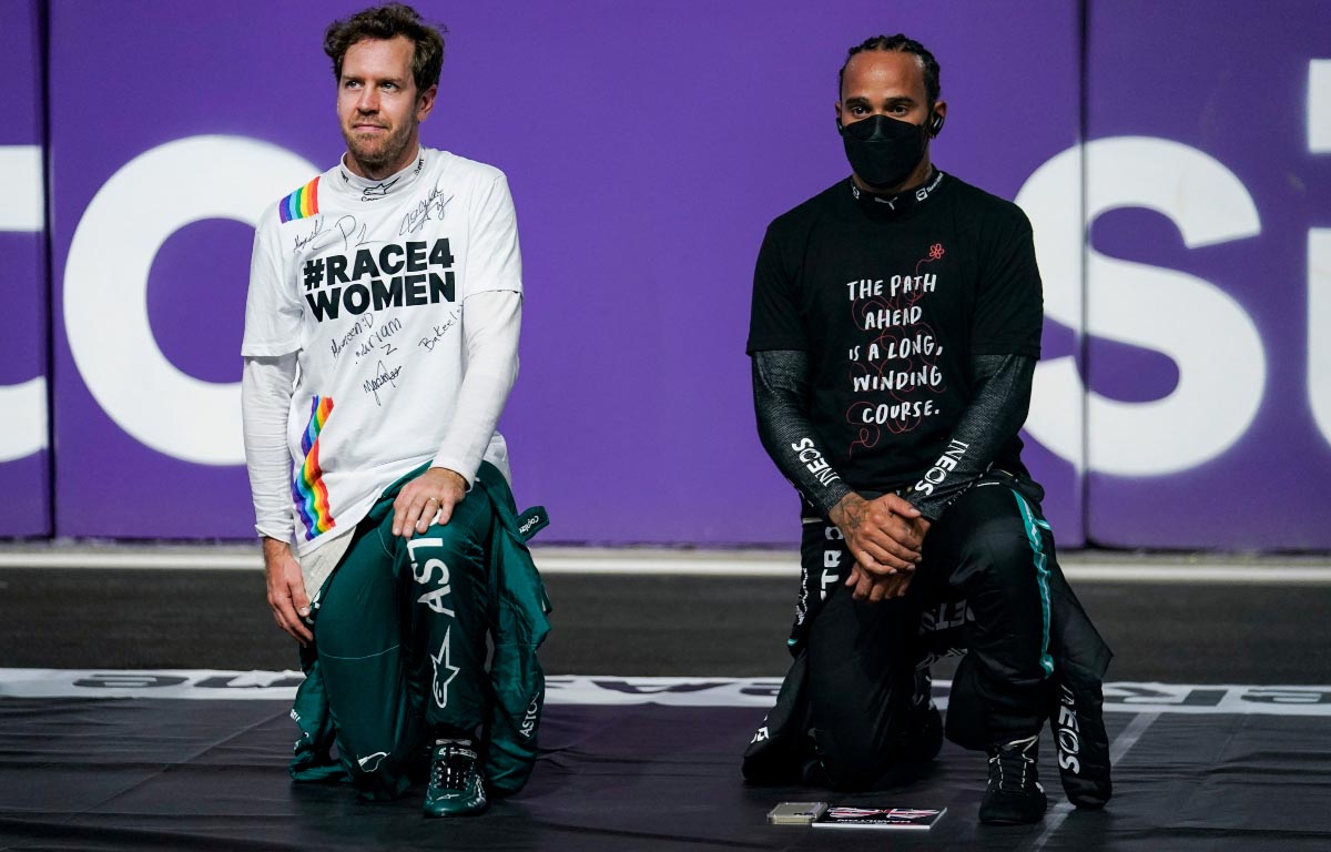 Sebastian Vettel and Lewis Hamilton kneel. Jeddah December 2021.