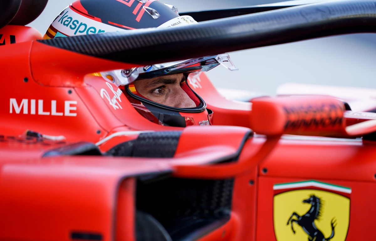 Carlos Sainz in a Ferrari with visor up. Abu Dhabi, December 2021.