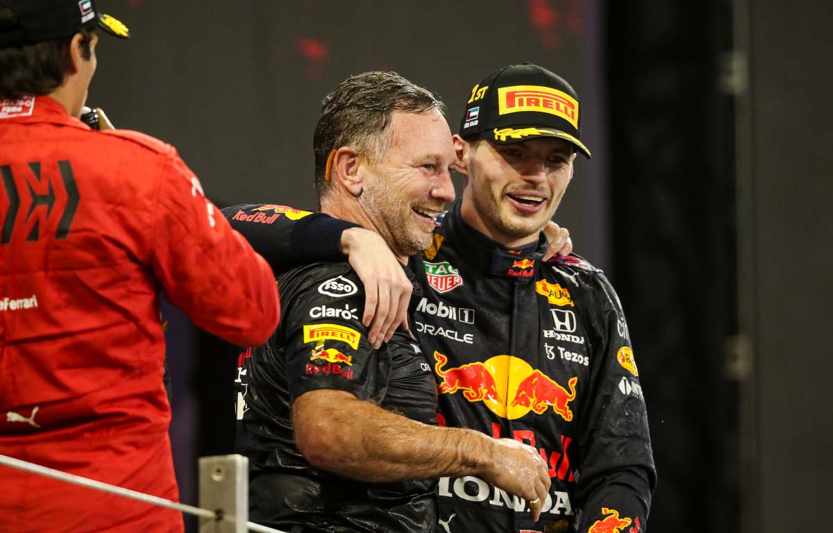 Christian Horner and Max Verstappen embrace. Abu Dhabi December 2021.