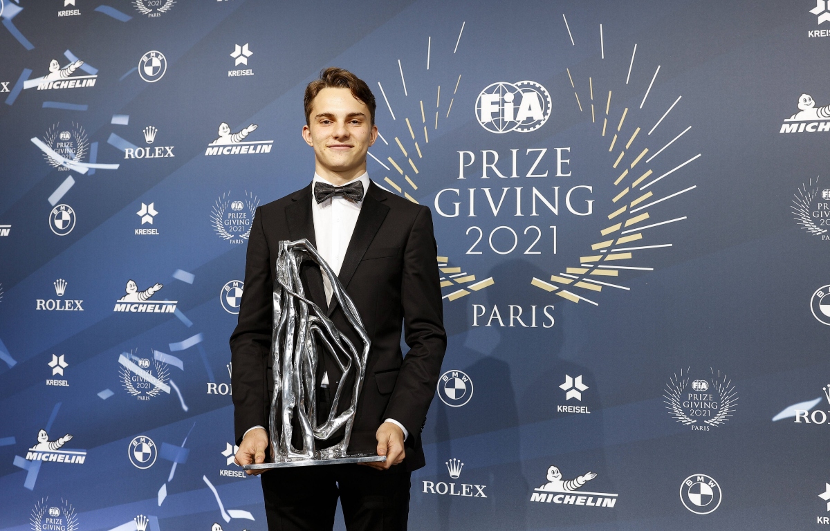Oscar Piastri holding the F2 trophy at the FIA Gala. December 2021