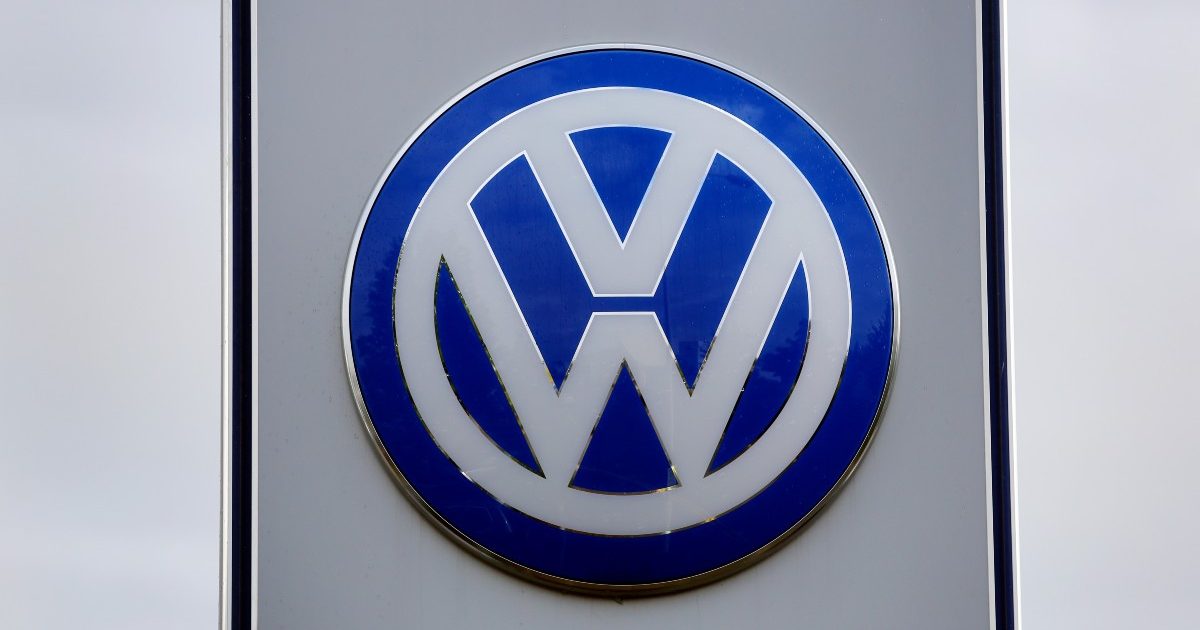 Volkswagen logo at a dealership. England, September 2015.