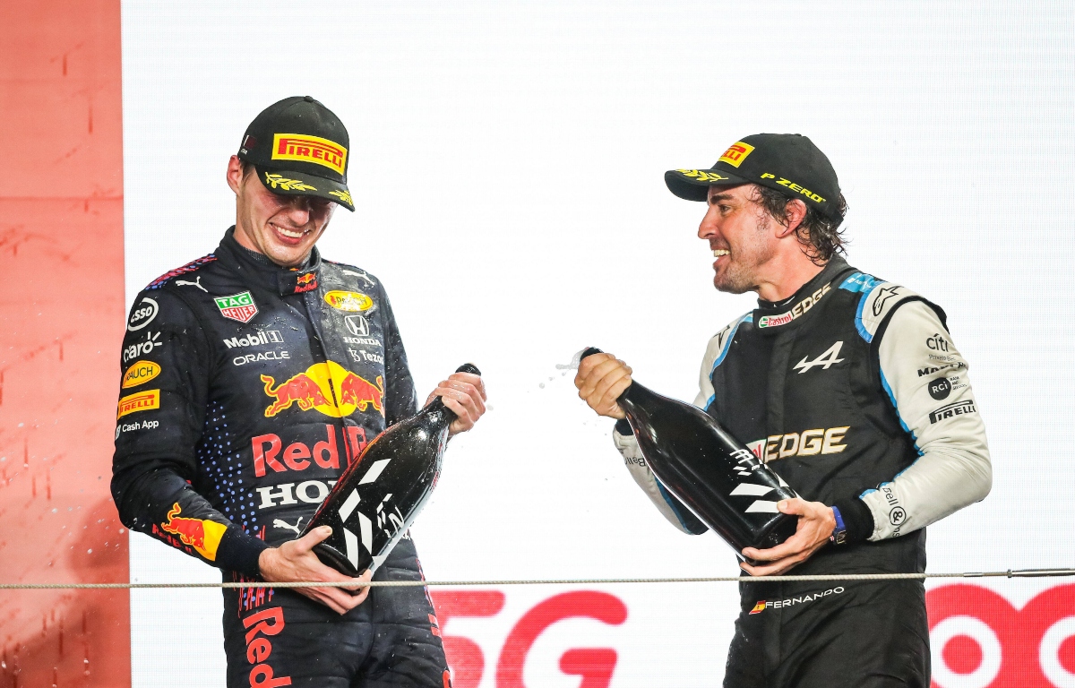 Max Verstappen and Fernando Alonso spraying champagne. Qatar November 2021