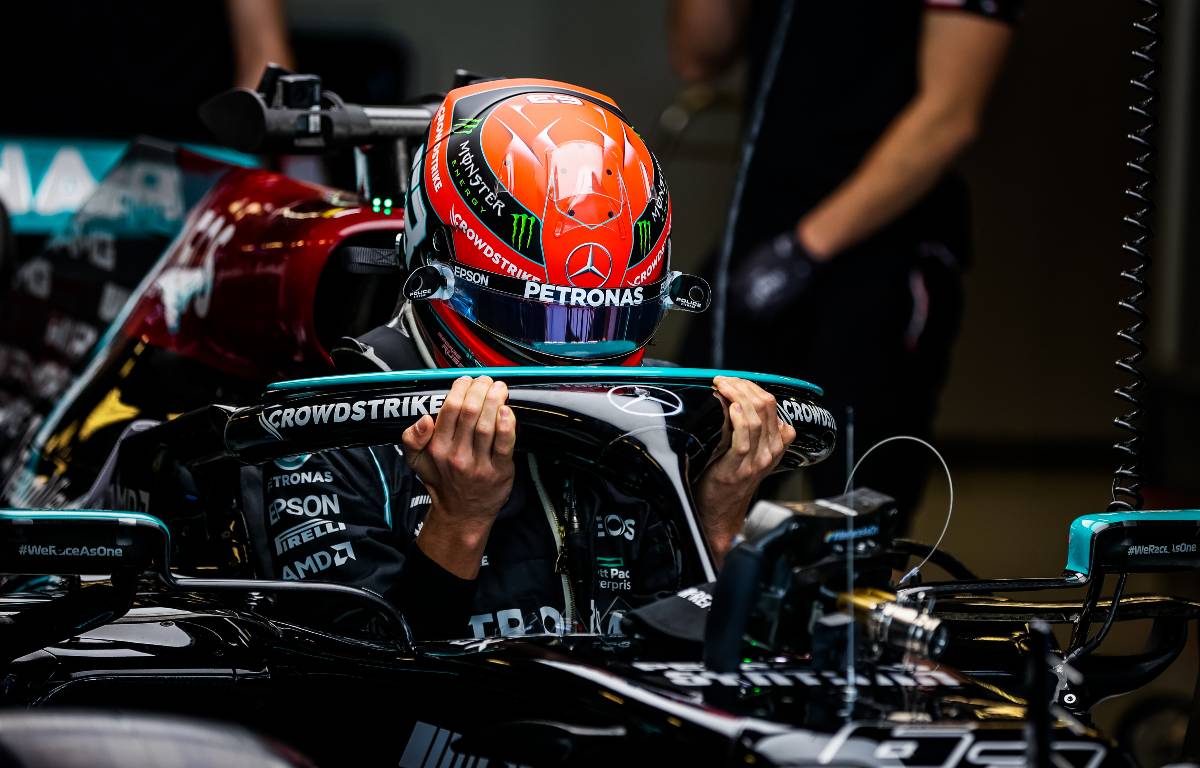 George Russell climbing into the Mercedes. Yas Marina December 2021.