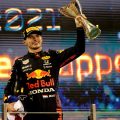 Max Verstappen holds the trophy aloft. Abu Dhabi December 2021.