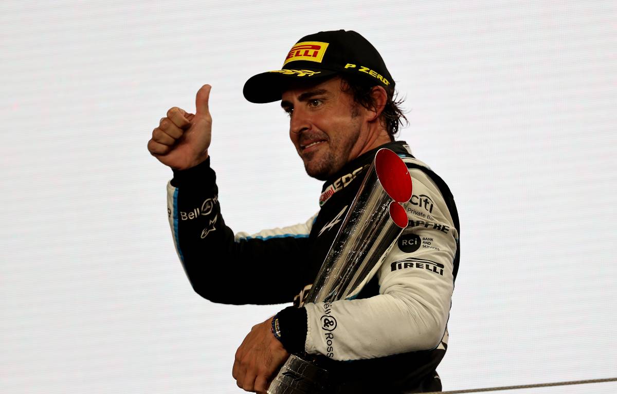 Fernando Alonso thumbs-up on the podium. Lusail November 2021.