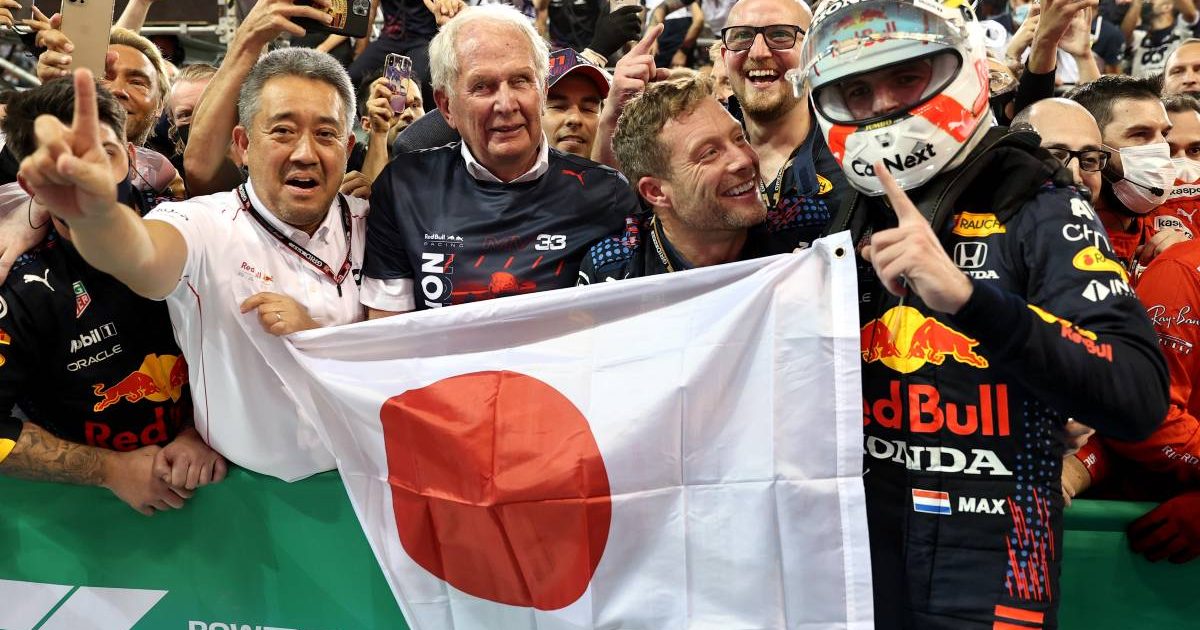 Max Verstappen, Helmut Marko and Honda's Masashi Yamamoto celebrate. Abu Dhabi December 2021.