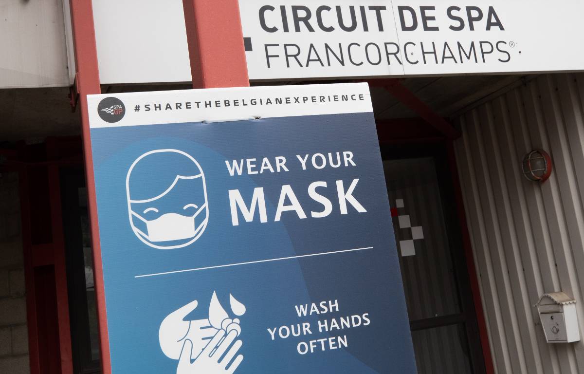 A sign giving guidance about avoiding the spread of COVID-19. Spa-Francorchamps August 2021.